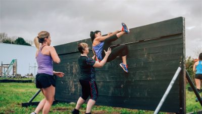 Group of female participants climbing.